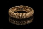 Bracelet en or jaune 18k (750 millièmes) à maille américaine....