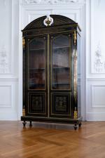 Armoire en marqueterie dite néo-boulle de laiton sur bois noirci....