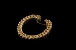 Bracelet gourmette en or jaune et rose 18k (750 millièmes)...