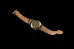 LECOULTRE. Memovox. Montre bracelet en plaqué or, figurant les heures...