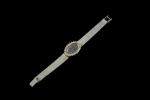 OMEGA.Montre bracelet de dame en or gris 18k (750 millièmes),...