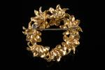 Broche en or jaune 18k (750 millièmes) formant couronne feuillagée,...