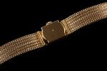 OMEGA.  Montre bracelet de dame en or jaune 18k...