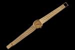 BAUME & MERCIER. 
Montre bracelet de dame en or jaune...