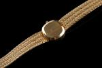 BAUME & MERCIER. 
Montre bracelet de dame en or jaune...