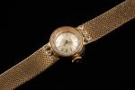 TISSOT.  Montre bracelet de dame en or jaune 18k...