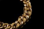 Bracelet gourmette en or jaune et rose 18k (750 millièmes)...