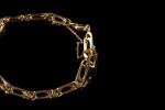 Bracelet en or jaune 18k (750 millièmes) à maille gourmette.Long....