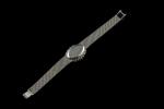 OMEGA.Montre bracelet de dame en or gris 18k (750 millièmes),...