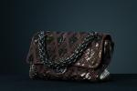 CHANEL. Sac East West en patchwork de cuirs de reptiles...