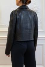 CHANEL. Veste spencer de la ligne "Identification" en cuir d'agneau...